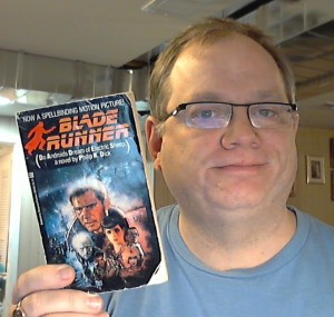 Posing with my 31 year old beat up copy of Blade Runner in paperback.